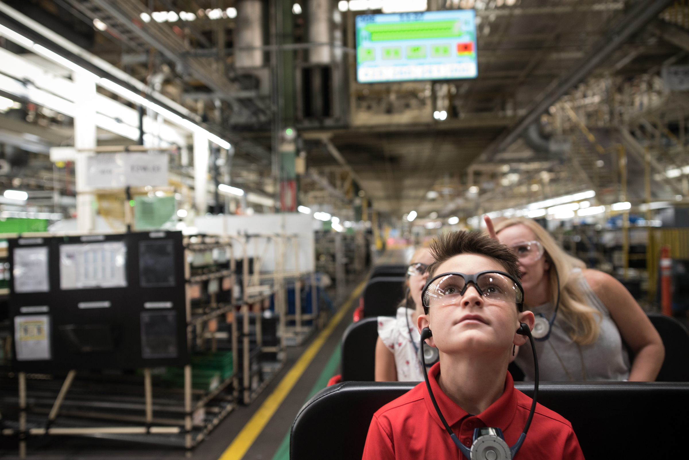 Student wears goggles on a MFG Day tour